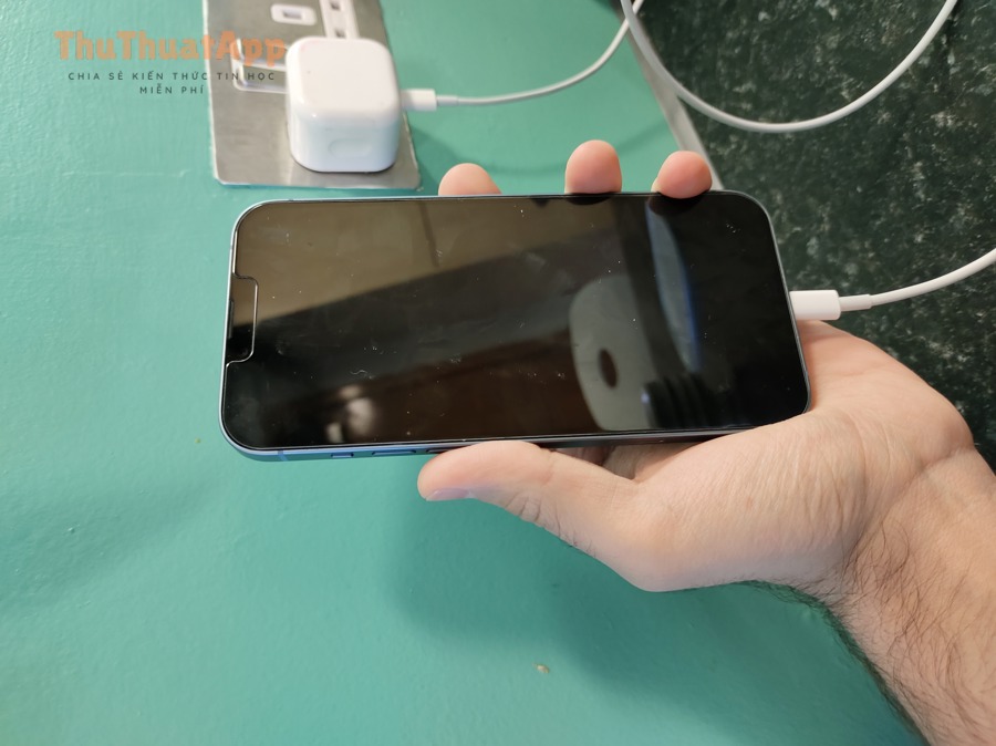 IPhone 14 Plus connected to a charger