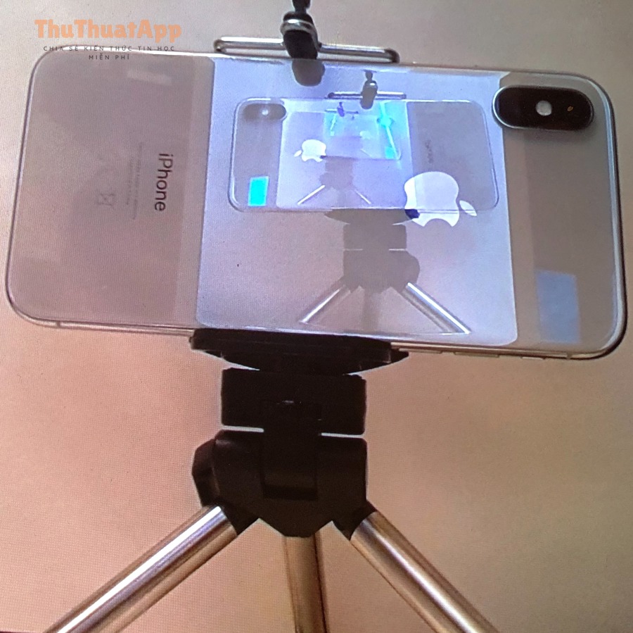 Iphone on tripod in front of a mirror triped by delayed action shutter release